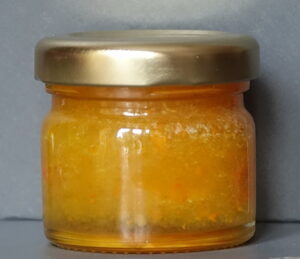 Crystallised ginger and turmeric infused natural set honey sample jar